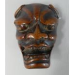 A Nicely Patinated 19th Century Japanese Carved Wood Netsuke of a Noh Mask.