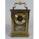 An Eight Day Brass Cased Carriage Clock by H Samuel,