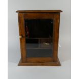 A Glazed Edwardian Oak Smokers Cabinet with Inner Drawer,