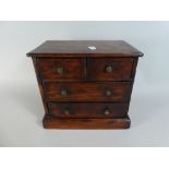 A Miniature Apprentice Chest of Two Short and Two Long Drawers Formed From a Former Cigar Box and