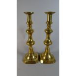 A Pair of Victorian Brass Candle Sticks with Pushers,