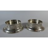 A Pair of Silver Plated and Pierced Wine Bottle Coasters,