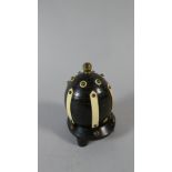 An Edwardian Beehive Shaped Match Striker with Brass Mounts,