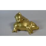 A Modern Brass Ornament of Two Sleeping Piglets,