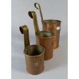 A Graduated Set of Three Brass Mounted Milk Measures,