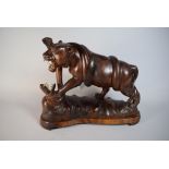 A Carved African Hardwood Study of Lion Fighting with Snake,