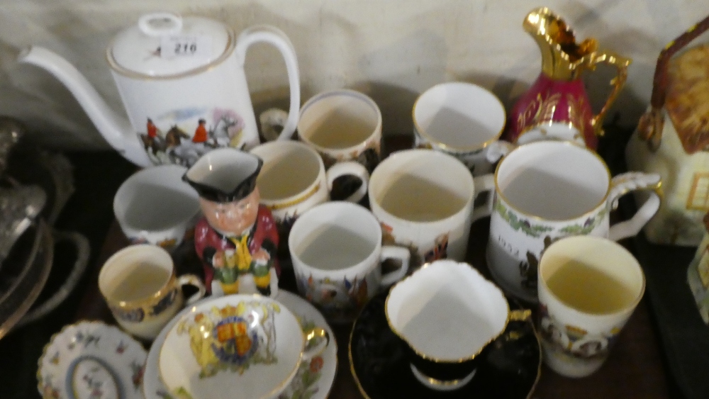 A Tray Containing Various Commemorative Mugs, Jugs,