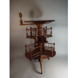 A Mahogany and Walnut Two Tier Revolving Bookcase Table with Pivoted Candlestick,