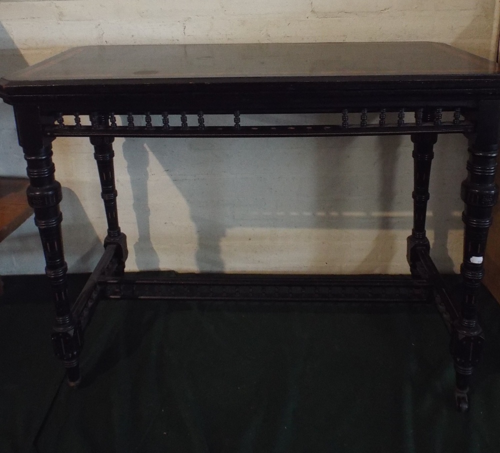 An Aesthetic Movement Lift and Twist Ebonised Games Table on Turned Supports, Some Missing Spindles, - Bild 2 aus 3