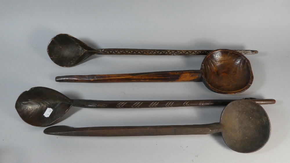A Collection of Four Carved African Wooden Spoons
