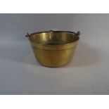 A Brass Jam Kettle with Iron Loop Handle,