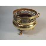 A Brass Soutterware Jardiniere on Three Claw feet with Pierced Rim and Three Lion Mask Ring Handles,