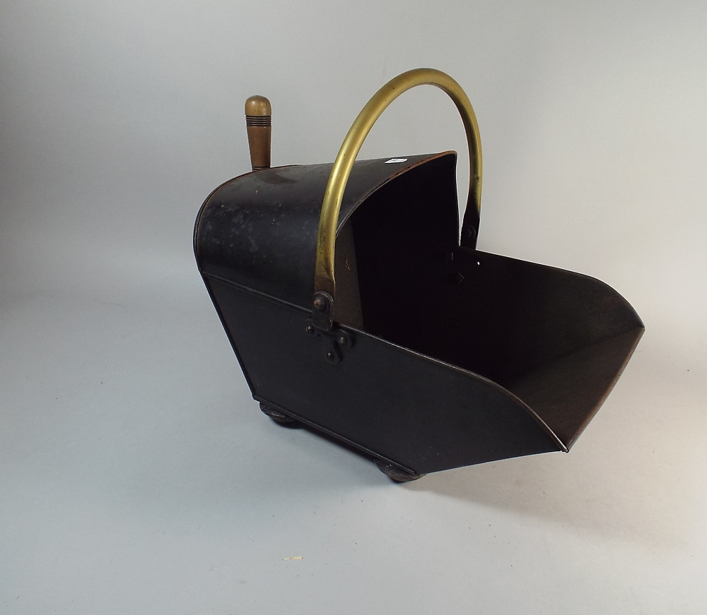 A Brass Mounted Toleware Helmet Shaped Coal Scuttle with Shovel,