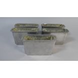 A Set of Five Stainless Steel Moulds,