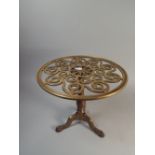 A Heavy Brass Tripod Kettle Stand with Circular Pierced Top,