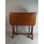 An Edwardian Oak Drop Leaf Sutherland Table with Turned Supports,