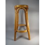 A Bamboo and Wicker Jardiniere Stand with Circular Top,
