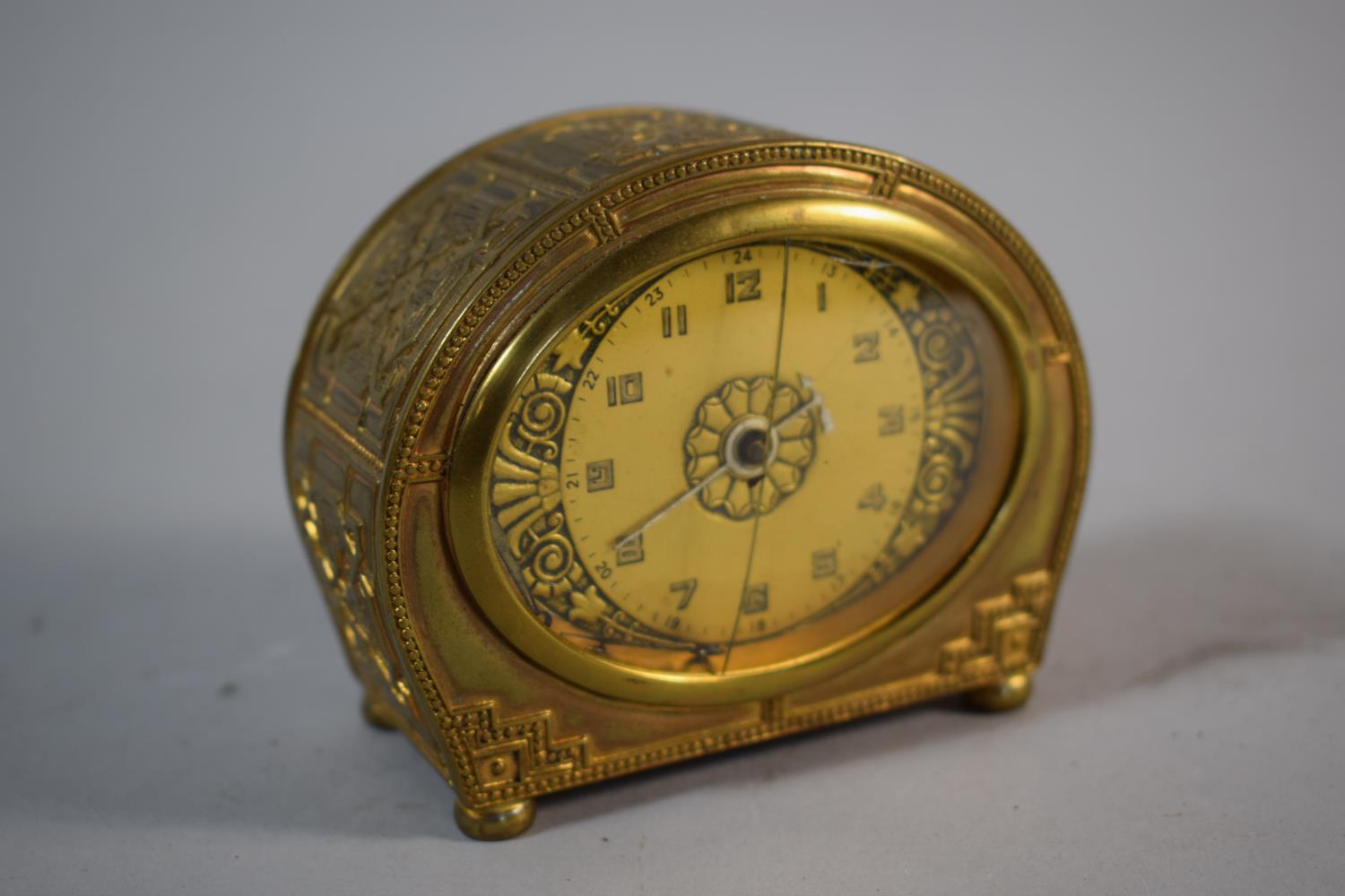 A Mid 20th Century Brass Alarm Clock with Body Decorated in Relief, Fingers Loose, Cracked Glass and - Image 2 of 3