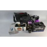 A Collection of Photographic Cameras and Sundries to Include Olympus 35mm Camera, Various Lenses,