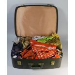 A Vintage Suitcase Containing Silk Scarves and Other Linens