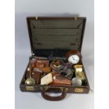 A Vintage Suitcase Containing Alarm Clocks, Table Lighter, Purses, Child's Wrist Watch, Cut Throat