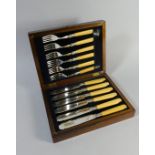 An Early 20th Century Oak Cased Canteen of Six Fish Knives and Forks