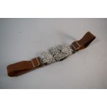 A Mid 20th Century Nurses Belt with Silver Plated Pierced Buckles and Sprung Back