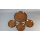 A Collection of Three Small and One Large Copper Plaques with Geometric Star Design, Impressed Marks