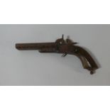 A Early 19th Century Side by Side Double Barrel Percussion Cap Pistol with Wooden Handle and Folding