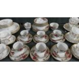 A Collection of English Rose Decorated China by Washington Pottery to Include Six Trios, Sugar and