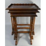 A Nest of Three Burr Walnut Tables with Turned Spindle Supports, The Largest with Raised Gallery,