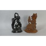 Two Cast Metal Door Stops, One in the Form of Mrs Punch and the Other in the Form of a Squirrel