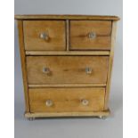 A 19th Century Pine Apprentice Piece Chest of Two Short and Two Long Drawers on Four Moulded Glass