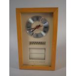 A 1970's Wall Mounting Clock and Auto Calendar with Battery Movement, 29cm High