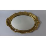 An Oval Gilt Framed Wall Mirror, 47cm High