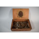 A Poker Work Decorated Cigar Box Containing a Quantity of Vintage Keys