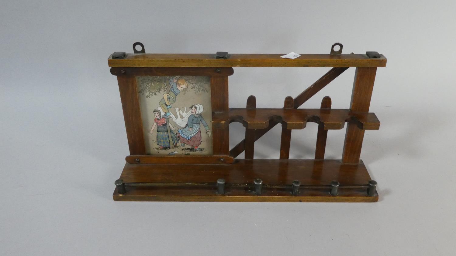 An Early 20th Century Pipe Rack with Raised Gallery Incorporating Print of Children Playing in