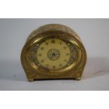 A Mid 20th Century Brass Alarm Clock with Body Decorated in Relief, Fingers Loose, Cracked Glass and