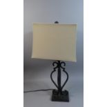 A Wrought Iron Table Lamp and Shade