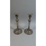 A Pair of Silver Plated Candle Sticks on Circular Feet, 27cm high