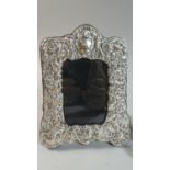 A Silver Easel Back Photo Frame with Repousse Decoration and Britannia Hall Mark, 16cm High