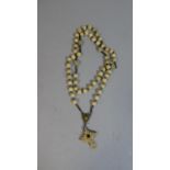 A Prayer Bead Necklace with Crucifix