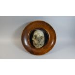 A Macabre Circular Wooden Wall Hanging with Applied Papier-mache of Skull, 36cm Diameter