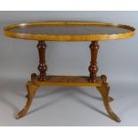 An Oval Galleried Occasional Coffee Table on Turned Supports, 77cm Long