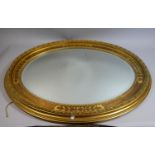 A Nice Quality Gilt Framed Oval Wall Mirror with Bevelled Glass, 87cm high