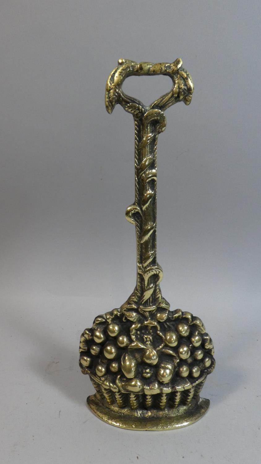 A 19th Century Brass Door Porter in the Form of Basket on Fruit, 36cm High