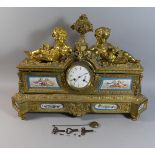 A Large French Gilt Bronze Figural Mantle Clock with Severe Style Panels Decorated with Cherubs