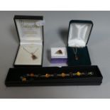 A Collection of Amber Costume Jewellery to Include Bracelets, Pendants, Ring etc