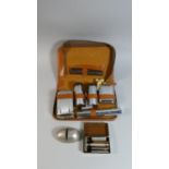 A Collection of Sundries to Include Gents Travelling Grooming Set, Travelling Razor, Knife Sharpener