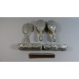 A Six Piece Silver Dressing Table Set Comprising Two Hair Brushes, Two Clothes Brushes, Mirror and